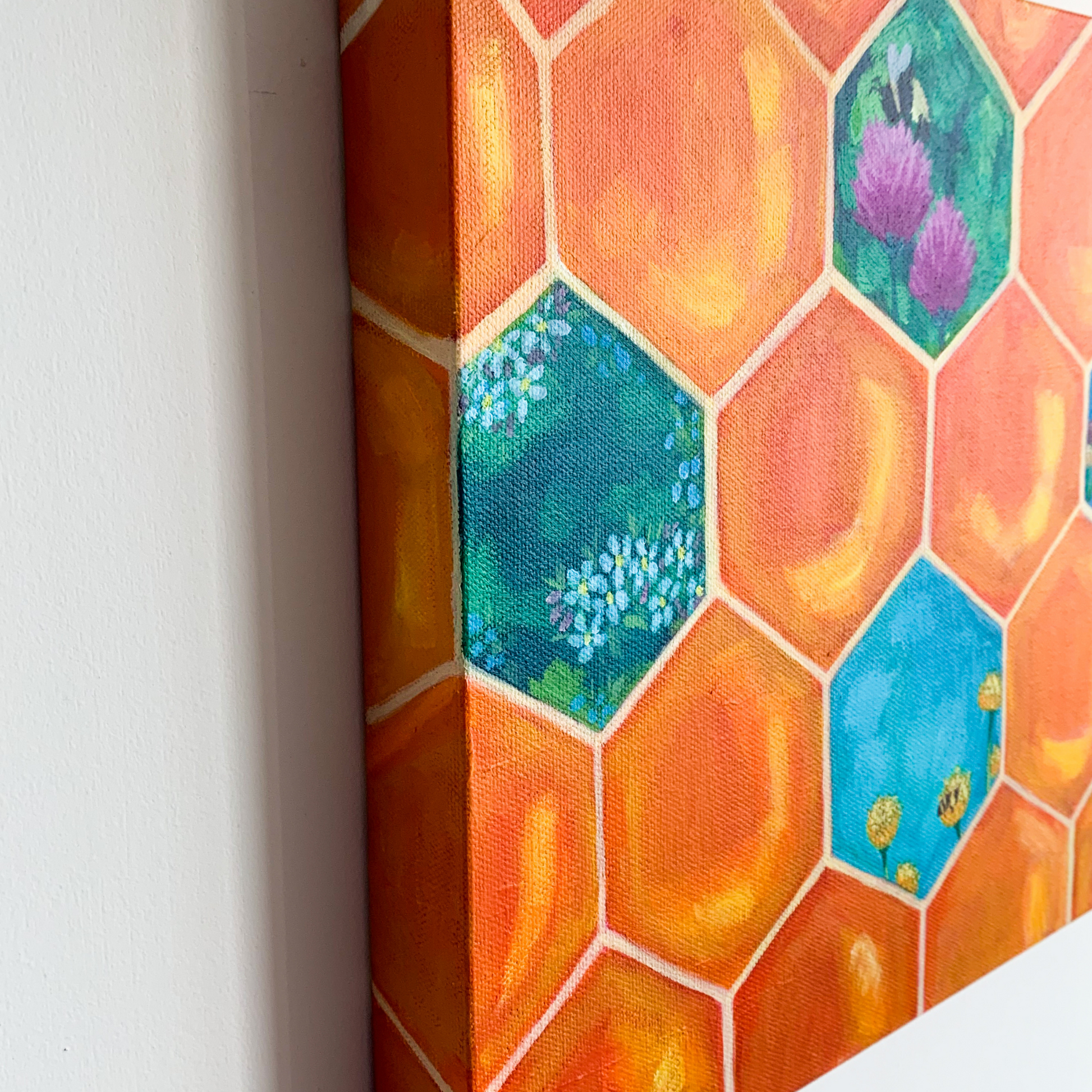 The side of the honeycomb painting showing the edges painted in orange honeycomb.