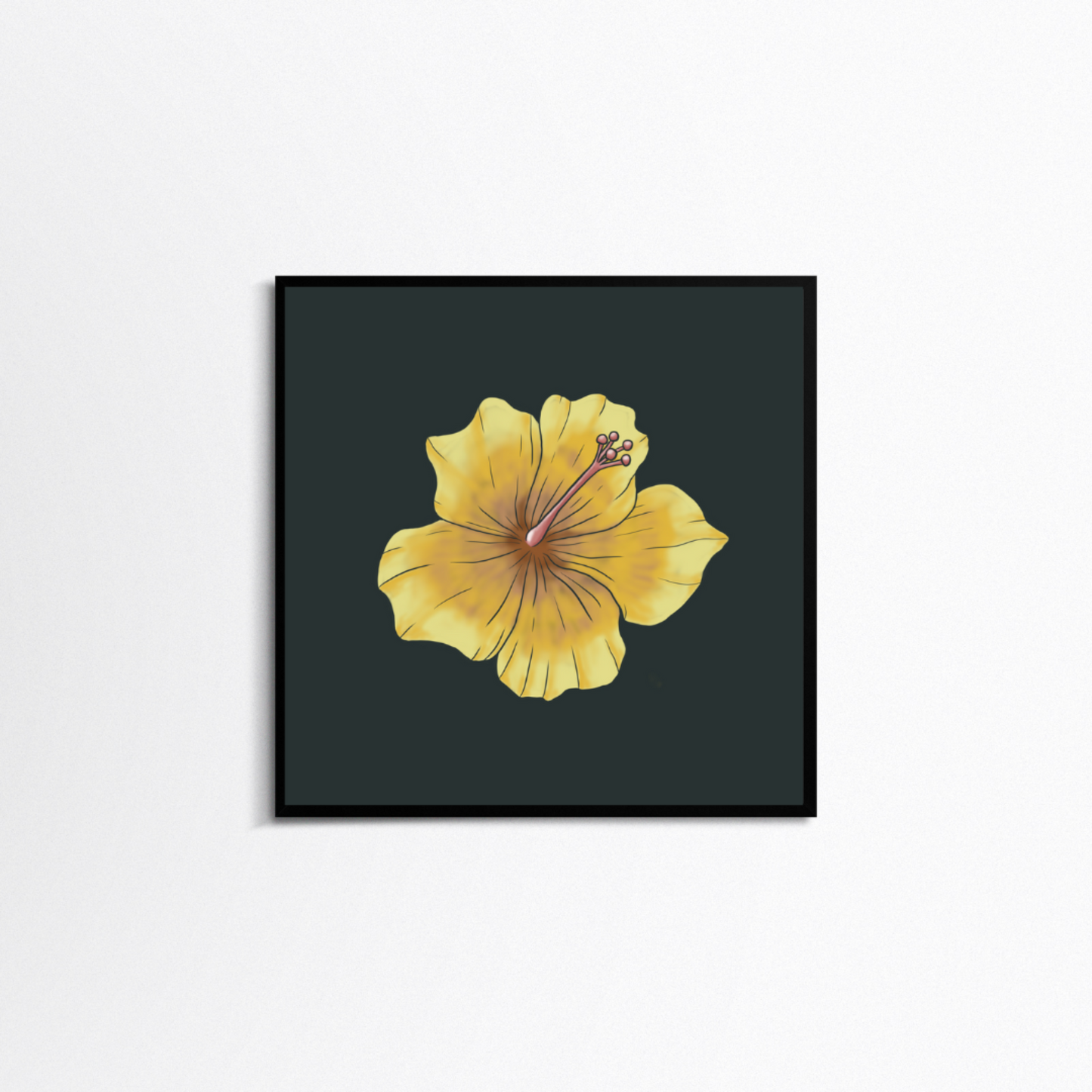 White background with a square black frame. In the frame is a print with a dark green background and a yellow hibiscus in the centre.